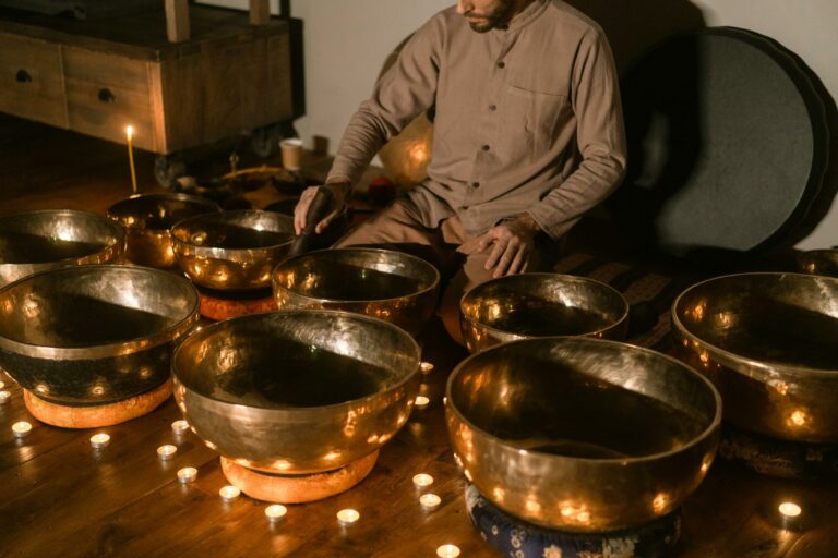 A serene setting with Tibetan singing bowls and candles, perfect for meditation and relaxation.